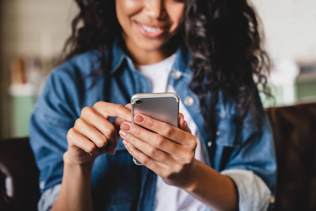 woman looking at cell phone