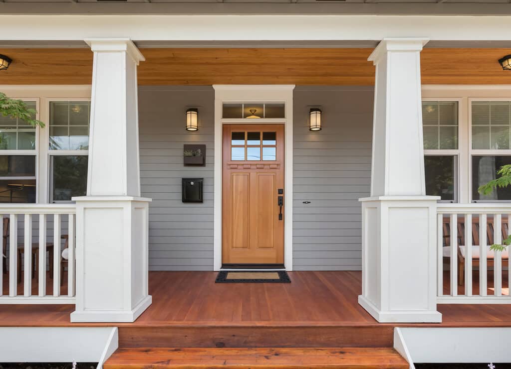 front door and porch of expensive looking home